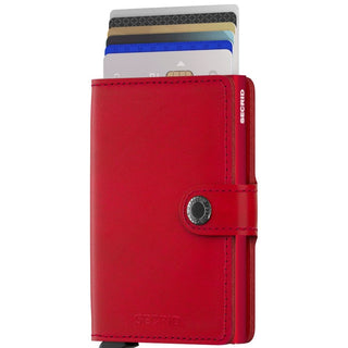 Secrid Miniwallet Original in red European cowhide leather with cards partially ejected and snap closure