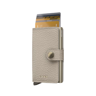 Secrid Miniwallet Pebble in beige European cowhide with cards partially extended and snap closure