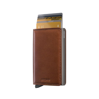 Secrid Slimwallet Texano with brown European cowhide leather and metallic card holder showing cards extended