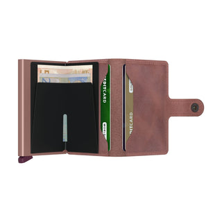 Secrid Miniwallet Vintage brown leather wallet open showing card compartments and metal case with banknotes