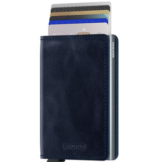 Secrid Slimwallet Vintage in navy blue European cowhide leather with cards partially ejected side view