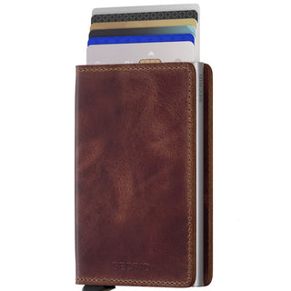 Secrid Slimwallet Vintage in brown European cowhide leather with cards partially ejected from metal case