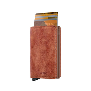 Secrid Slimwallet Vintage in brown European cowhide leather with cards partially ejected, textured finish visible