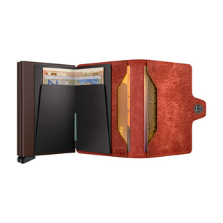 Secrid Twinwallet Vintage open showing red European cowhide leather and black cardholder mechanism with banknotes and cards