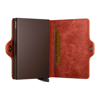 Secrid Twinwallet Vintage open showing brown smooth metal case and rustic textured cowhide leather interior