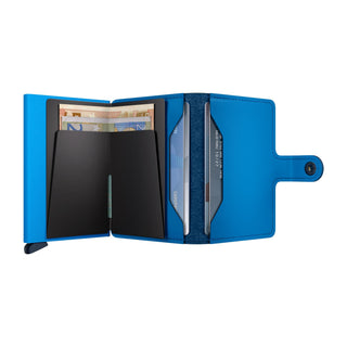 Secrid Miniwallet Yard Powder opened showing blue microfiber interior with cards and banknotes stored