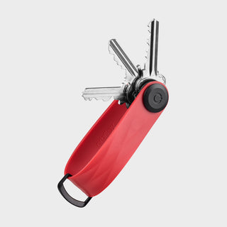 Orbitkey Active Key Organizer in red with stainless steel keys folded inside compact design
