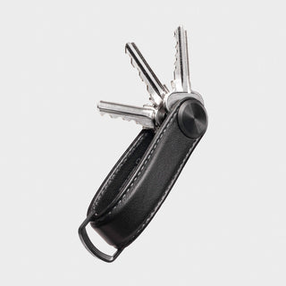 Orbitkey Key Organizer Pro Leather with black genuine leather and silver keys fanned out against white background