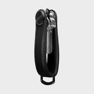 Orbitkey Key Organizer Pro Leather holding multiple keys in black smooth leather with metal button closure
