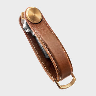 Orbitkey Key Organizer Pro Leather in brown with gold hardware holding multiple keys compactly