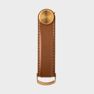 Orbitkey Key Organizer Pro Leather in brown with brass hardware shown flat against gray background