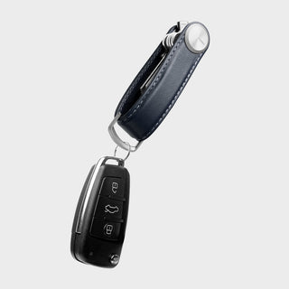 Orbitkey Key Organizer Pro Leather in navy with visible stitching holding multiple keys and a car key fob