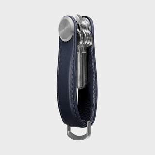Orbitkey Key Organizer Pro Leather in navy with visible metallic keys and stitched edges standing upright