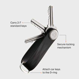 Orbitkey Active Key Organizer in black with stainless steel button and multiple attached keys