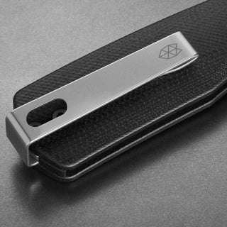 James The Carter Knife by The James Brand showing black Micarta handle with silver metal clip detailed engraving