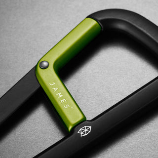 James The Hardin Carabiner with anodized green aluminum latch and matte black frame close-up view