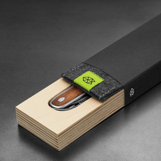 James The Pike Knife with rosewood handle partially inside wooden and felt black box by The James Brand