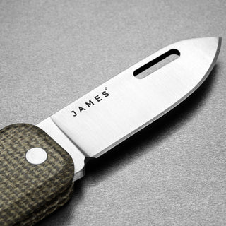 James The Elko Knife close-up showing Sandvik steel blade with carbon fiber textured handle by The James Brand