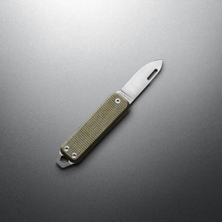 James The Elko Knife with olive green Micarta handle and stainless blade on gray background