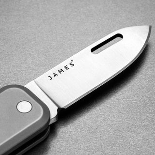 James The Elko Knife blade close-up showing Sandvik steel and precision cutting edge