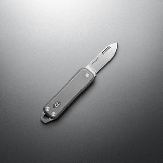 James The Elko Knife with sleek gray handle and compact folding blade showing edge detail
