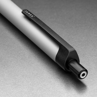 Close-up of James The Burwell Ballpoint Pen Bone body, black end and accent ring