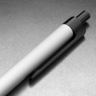 Close-up of James The Burwell Ballpoint Pen Bone body with black clip and clicker