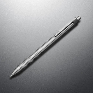 James The Burwell Ballpoint Pen in titanium finish, angled on grey