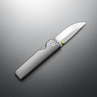 James The Chapter 2 Knife with titanium handle and satin-finished s35vn blade partially open on gray surface