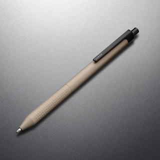 James The Burwell Ballpoint Pen in Desert Campout finish, angled on grey