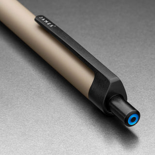 Close-up of James The Burwell Ballpoint Pen Desert Campout end and blue accent ring