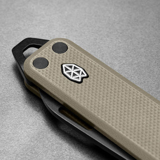 James The Elko Knife with textured tan Micarta handle and black metal clip by The James Brand