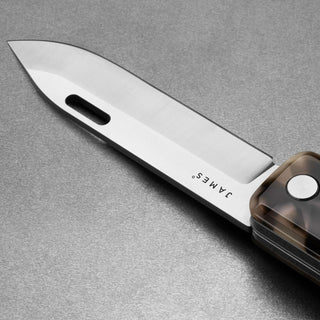 James The Ellis Scissors Knife with polished Sandvik 12C27 steel blade and translucent handle detail