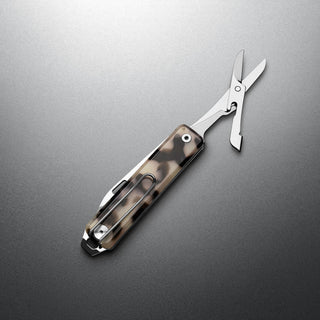 James The Ellis Scissors Knife with eco-acetate handle and stainless steel blades open on gray background