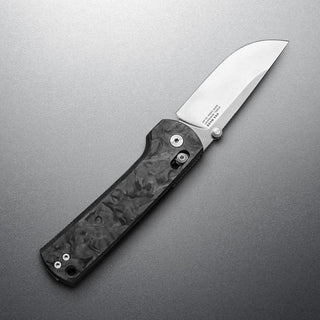 James The Kline Knife featuring a polished CPM Magnacut blade with textured dark Micarta handle