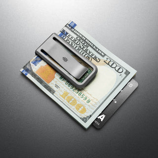 James The Martindale Money Clip holding cash and cards made from sleek titanium by The James Brand