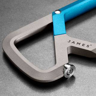 James The Mehlville Carabiner close-up showing anodized aluminum frame with blue latch and stainless steel screw