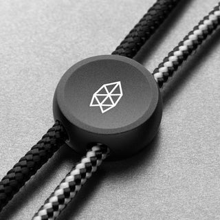 James The Ulu Lanyard & Bead in black anodized aluminum with etched geometric logo on nylon paracord strands