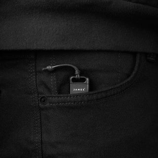 James The Warrick Bit Driver in black anodized aluminum with lanyard clipped to pocket