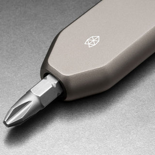James The Warrick Bit Driver with anodized aluminum handle and precision screwdriver bit close-up