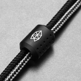 James The Alder Lanyard & Bead featuring anodized black aluminum bead with laser-etched logo on nylon paracord strands