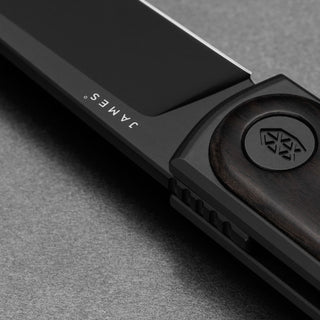 James The Duval Knife with black blade and polished dark rosewood handle close-up by The James Brand