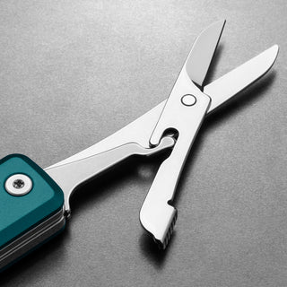 James The Ellis Scissors Knife with polished steel blades and teal textured handle detail by The James Brand