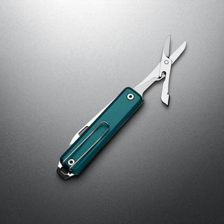 James The Ellis Scissors Knife with teal Micarta handle and stainless steel scissors extended