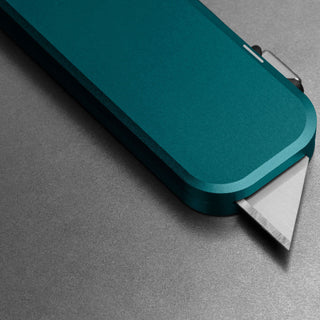 James The Palmer Knife with anodized teal aluminum handle and sharp high carbon steel blade edge