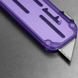 James The Palmer Recycled PC Knife with translucent purple recycled PCTG handle and sharp utility blade close-up