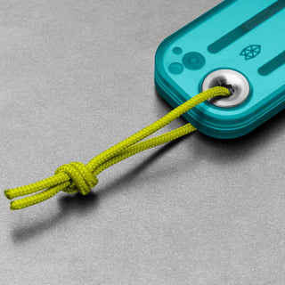 Close-up of teal James The Palmer Recycled PC Knife handle with yellow woven lanyard looped through metal eyelet