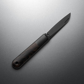 James The Wayland Knife with dark ebony handle and sleek black blade on gray background