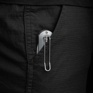 James The Wells Knife clipped to black fabric pocket showing sleek aluminum handle and secure clip design