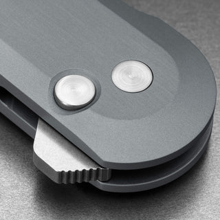 Close-up of aerospace grade aluminum handle and button lock mechanism on James The Wells Knife by The James Brand